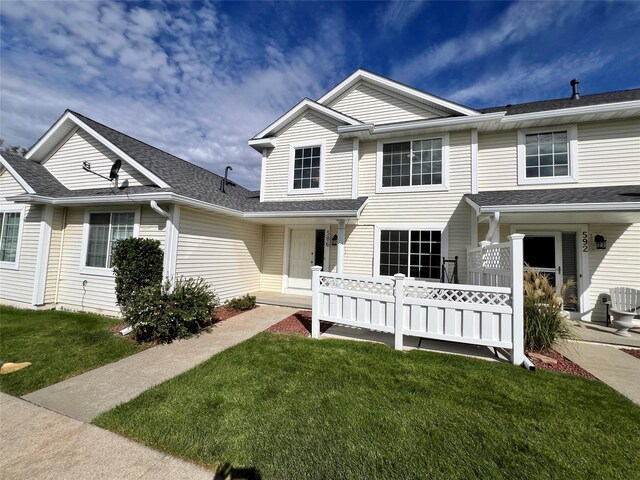 view of front of home featuring a porch and a front lawn