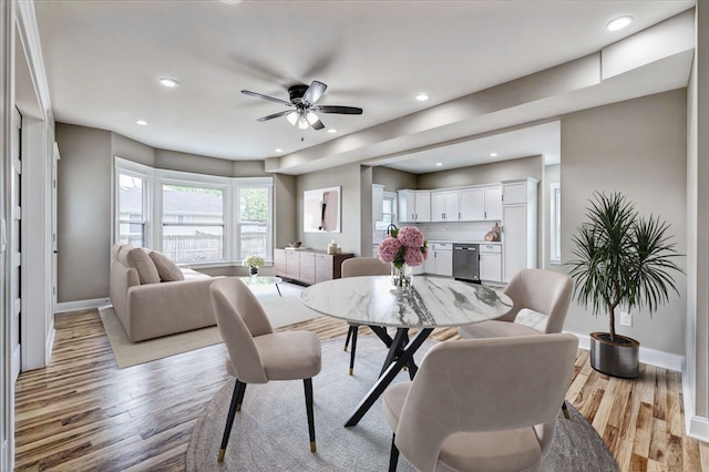 dining room featuring light hardwood / wood-style floors and ceiling fan