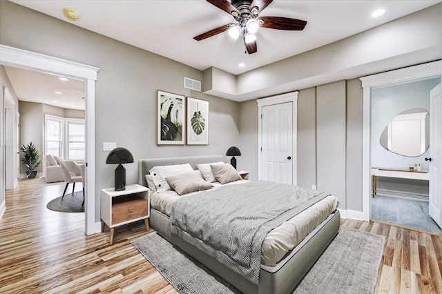 bedroom featuring ceiling fan and light hardwood / wood-style flooring