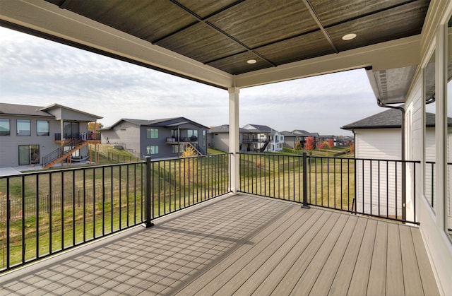 wooden terrace with a yard