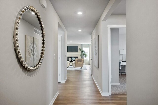 hallway featuring hardwood / wood-style floors