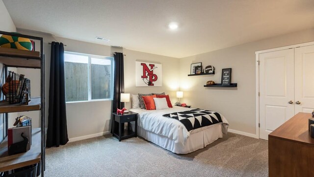 bedroom featuring carpet and a closet