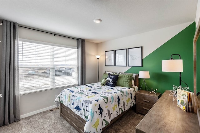 bedroom with carpet and a textured ceiling