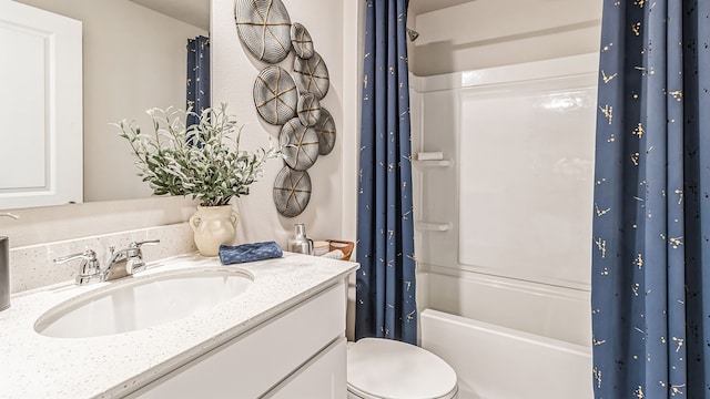 full bathroom with shower / bath combo with shower curtain, vanity, and toilet