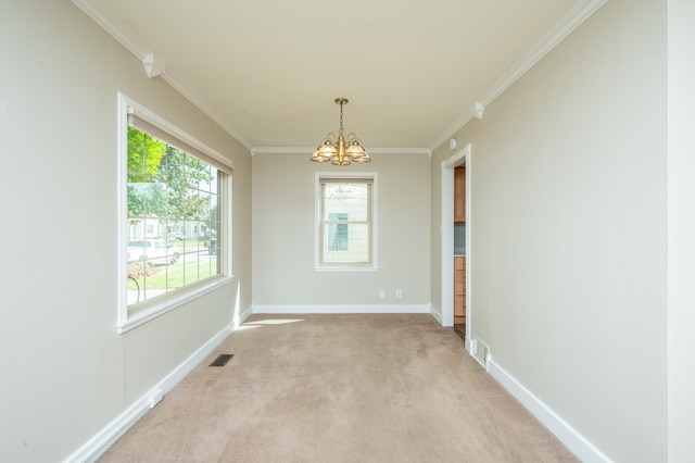 unfurnished room featuring ornamental molding, a chandelier, and light carpet