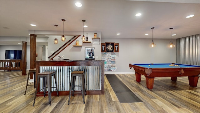 rec room with wood-type flooring, billiards, bar area, and ornate columns