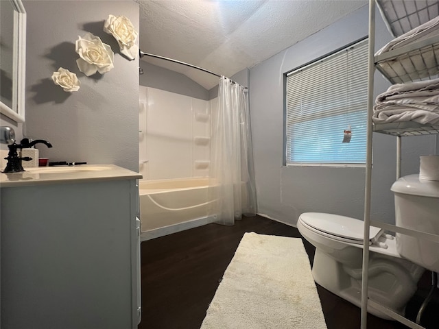 full bathroom featuring vanity, wood-type flooring, a textured ceiling, shower / bathtub combination with curtain, and toilet