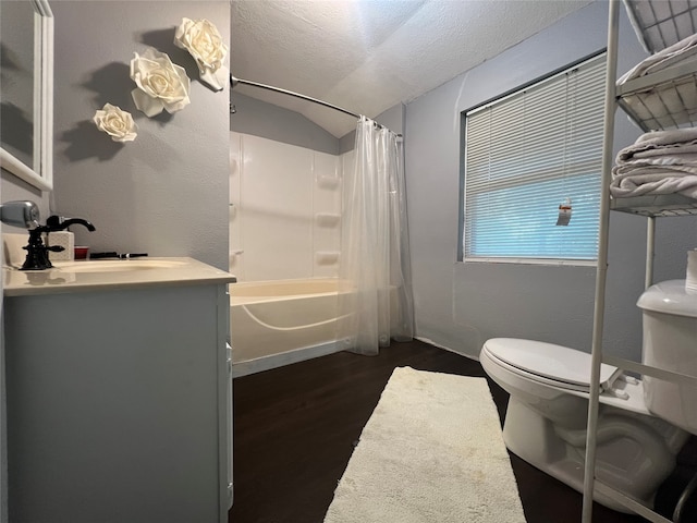 full bathroom featuring vanity, shower / bath combo, a textured ceiling, hardwood / wood-style flooring, and toilet