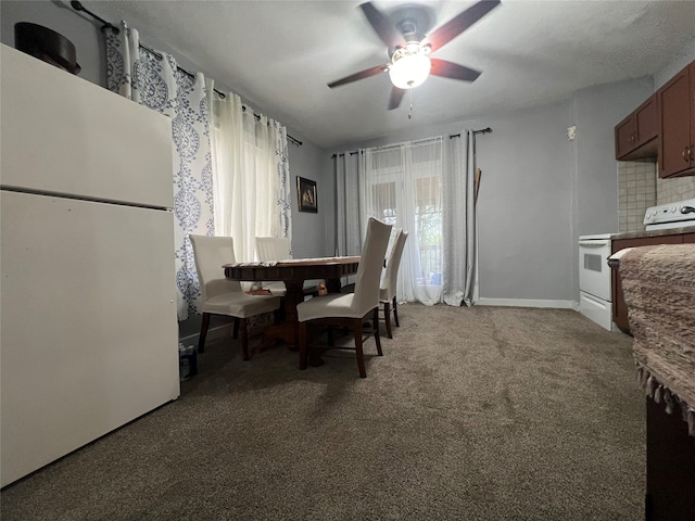 carpeted dining room with ceiling fan and a healthy amount of sunlight