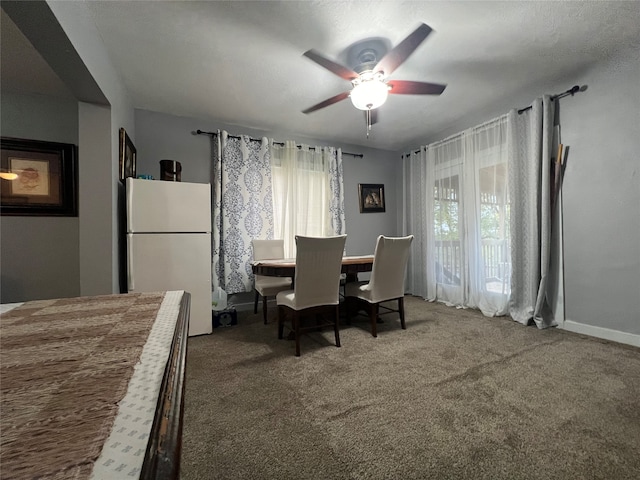 dining room featuring ceiling fan and carpet flooring