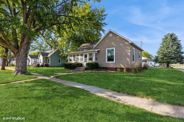 view of front of home with a front yard