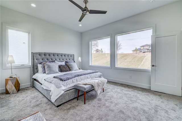 carpeted bedroom featuring ceiling fan