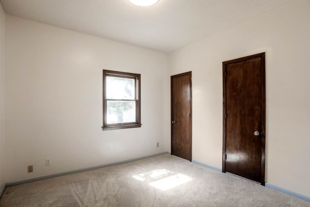 unfurnished bedroom featuring carpet