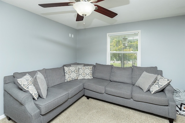 carpeted living room featuring ceiling fan