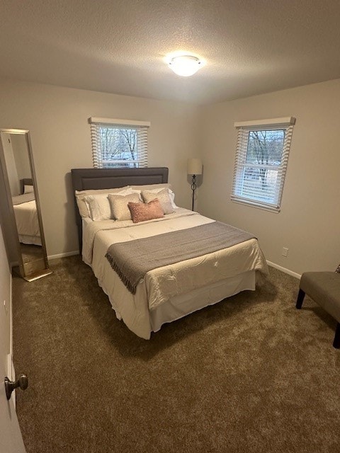 carpeted bedroom with a textured ceiling