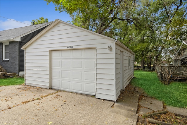 garage featuring a yard