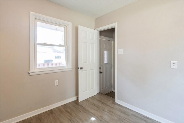 spare room featuring light hardwood / wood-style floors