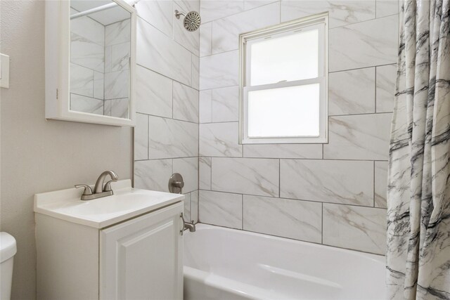 full bathroom featuring vanity, toilet, and shower / bathtub combination with curtain