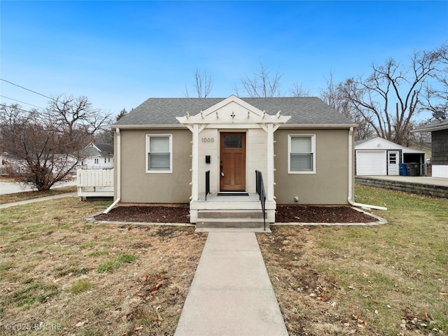 bungalow-style house with a front yard