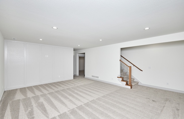 basement with light carpet