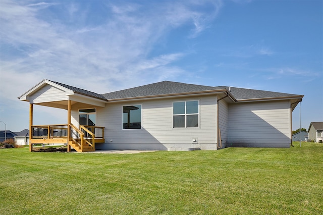 back of house with a yard and a wooden deck