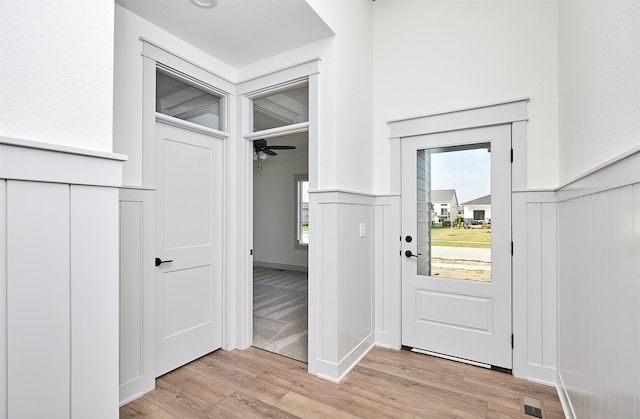 interior space featuring light wood-type flooring and ceiling fan