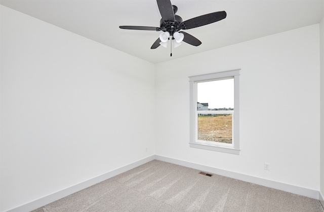 unfurnished room featuring carpet flooring and ceiling fan