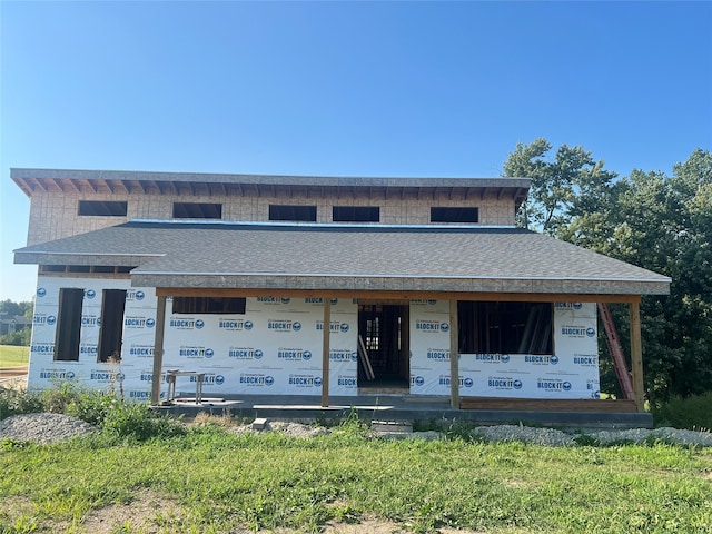 unfinished property featuring a front lawn