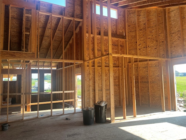 miscellaneous room featuring a towering ceiling