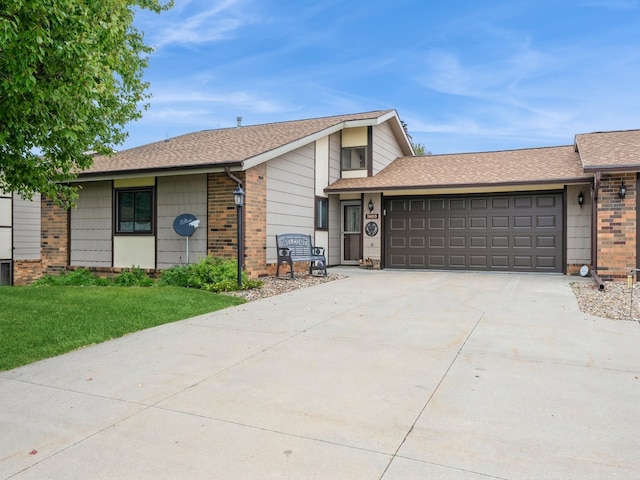 ranch-style home featuring a garage