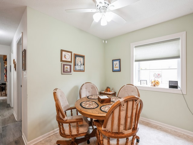 dining space featuring ceiling fan