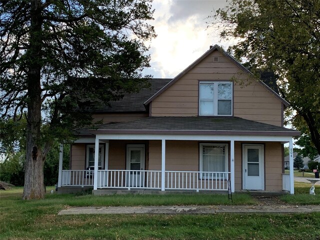 804 E Main St E, Panora, IA 50216 - country-style home with a porch and a shingled roof