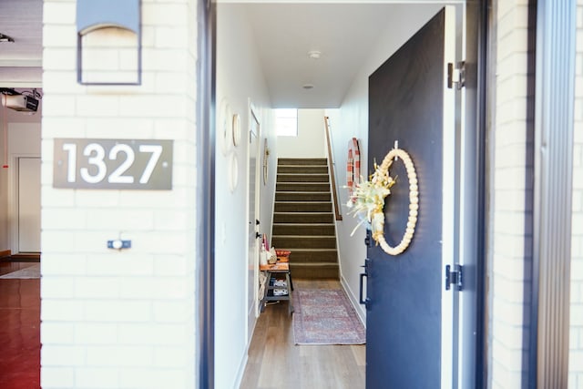 corridor featuring hardwood / wood-style floors