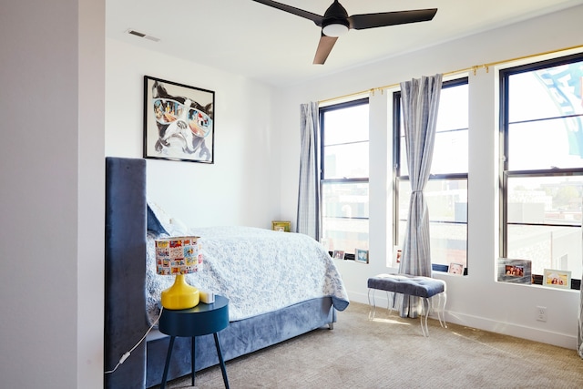 carpeted bedroom featuring ceiling fan