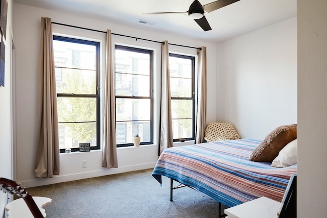 bedroom with ceiling fan and carpet floors