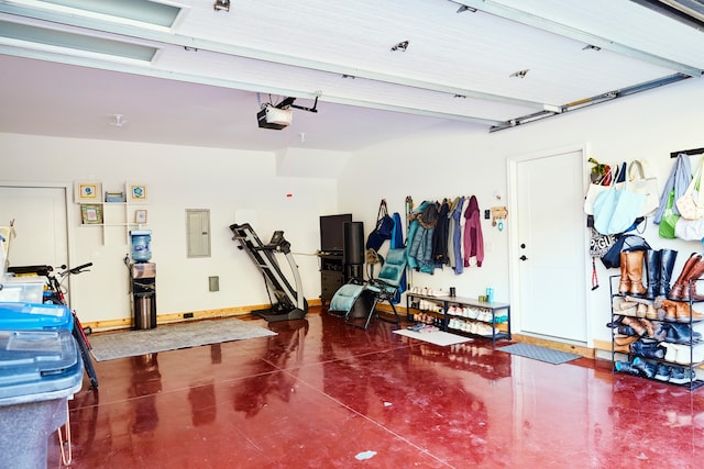 garage featuring electric panel and a garage door opener