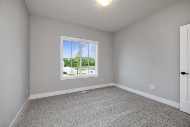 spare room featuring carpet flooring