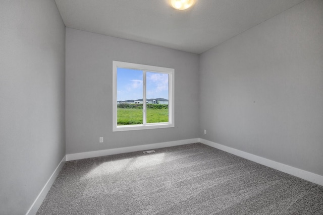 empty room with carpet flooring