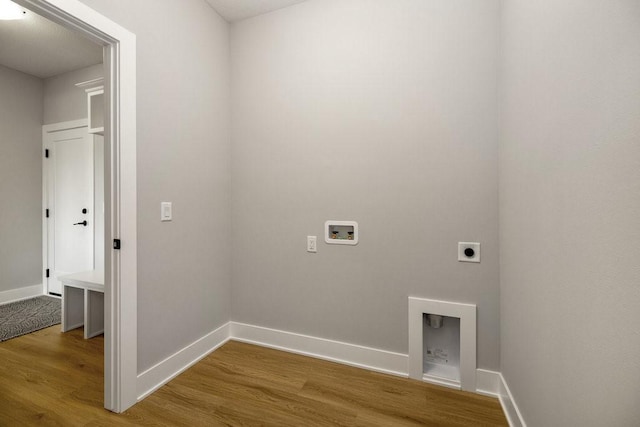 clothes washing area featuring washer hookup, hardwood / wood-style floors, and hookup for an electric dryer