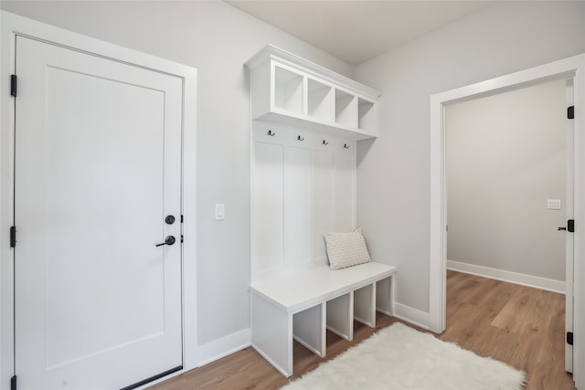 mudroom with light hardwood / wood-style flooring