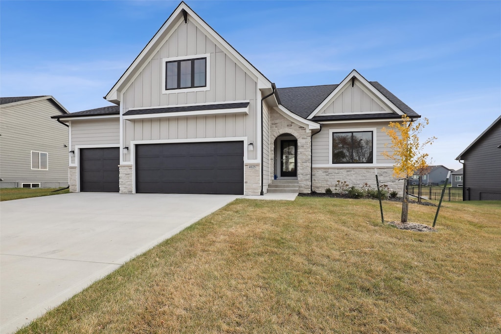 view of front facade with a front yard and a garage