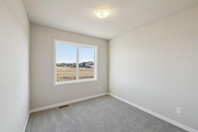 empty room featuring carpet flooring