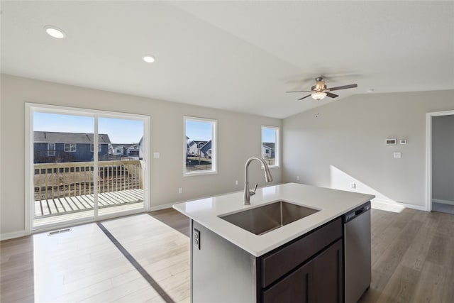 2105 White Oak Ln, Granger, IA 50109 - kitchen with dishwasher, wood finished floors, a ceiling fan, light countertops, and open floor plan