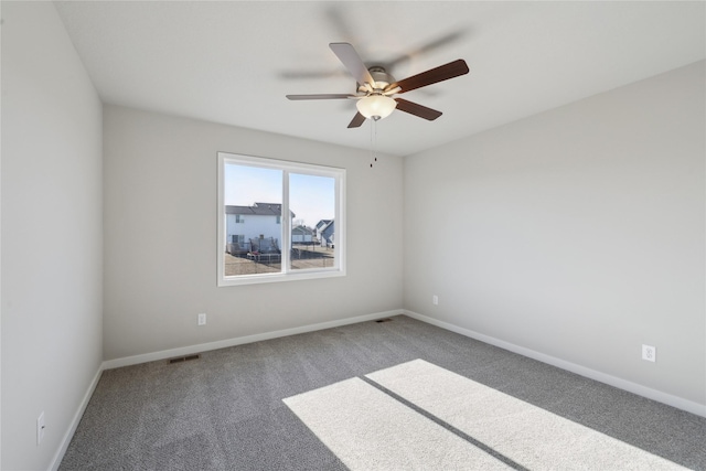 unfurnished room featuring carpet flooring and ceiling fan