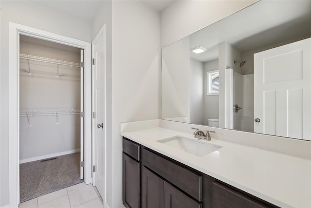 2105 White Oak Ln, Granger, IA 50109 - full bathroom featuring a shower, vanity, and a spacious closet
