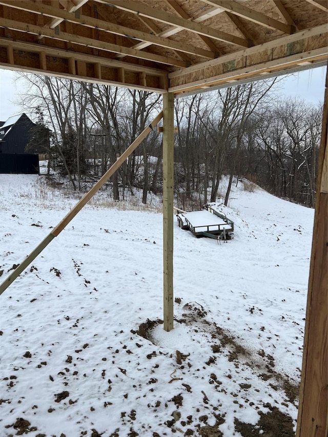 view of yard layered in snow