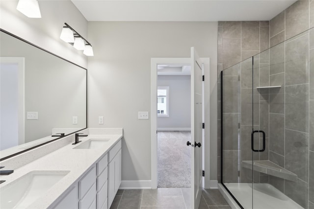 bathroom featuring vanity, tile patterned floors, and a shower with shower door