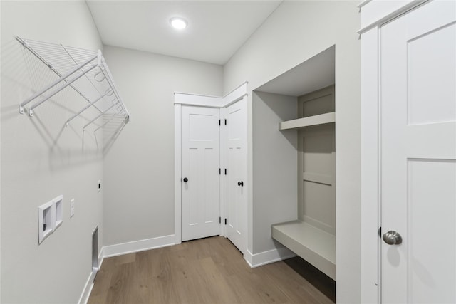 laundry area featuring hookup for an electric dryer, washer hookup, and light hardwood / wood-style floors