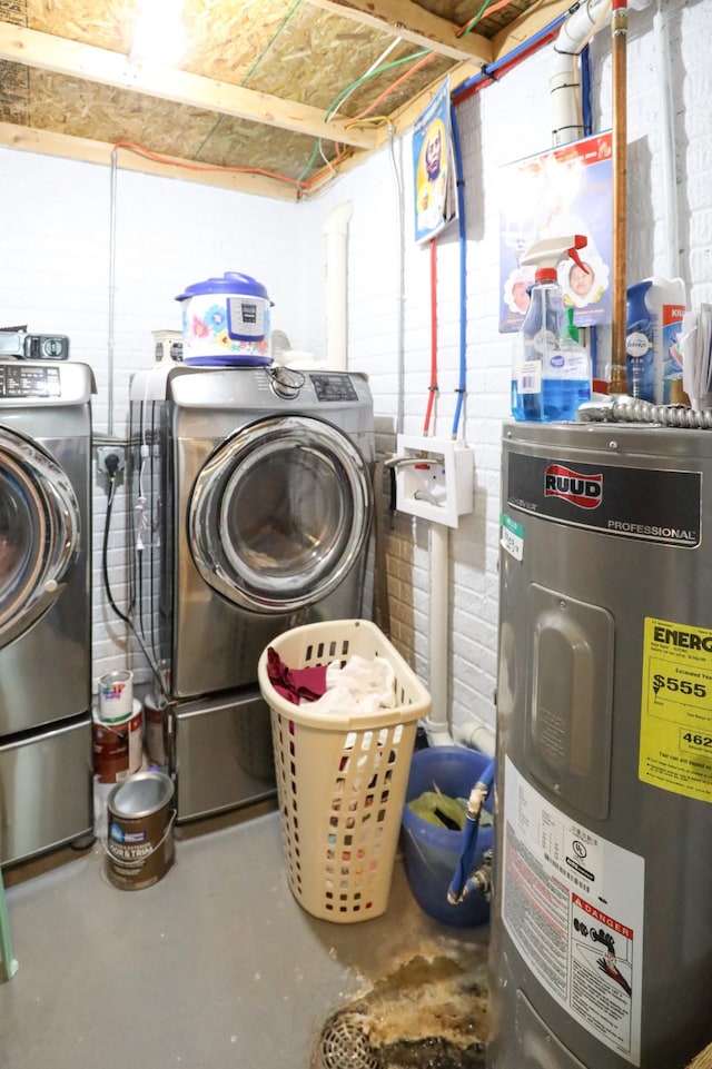 laundry area with water heater and independent washer and dryer