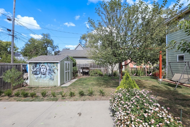 view of yard with a storage unit and a patio